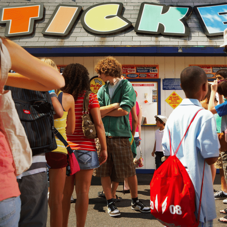 Group of children and teenagers at a ticket counter